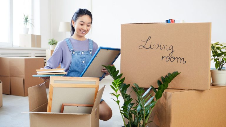 Picture of woman unpacking boxes