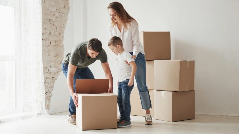 Image of family with moving box
