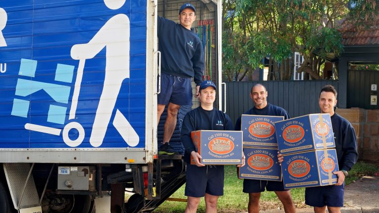 Hire A Mover image team with boxes near truck